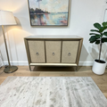 Rosdorf Park Morfa Gray Wood Upholstered Front Panel 1 Shelf & 3 Doors Cabinet w/ Mirrored Top & Ring Handles